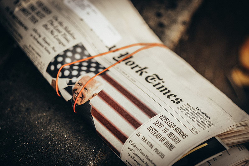 Rolled up New York Times newspaper